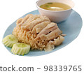 Hainanese chicken rice served on a plate with soup 98339765