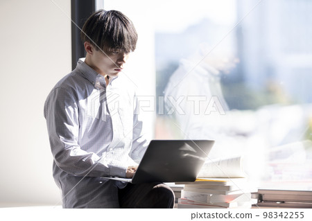 Young men reading 98342255