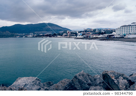 View on coast of the Black Sea of Sudak from Cape Alchak in cloudy weather. Crimea 98344790