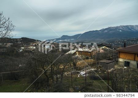 View of the village Luchistoe from the slope of Demerdzhi mounting in spring. Crimea View of the village Luchistoe from the slope of Demerdzhi mounting in spring. Crimea 98344794