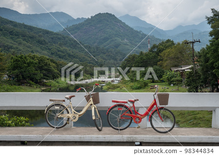 The bike and beautiful landscape of Kiriwong village located at Kamlonsubdistrict, Laan Saka district, Nakhon Si Thammarat province.  98344834