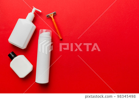 shaving man set. shaving machine, towel, lotion and shaving foam on colored background. Men bath Accessories top view 98345498