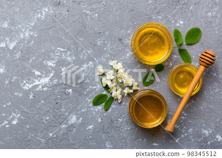 honey jar with acacia flowers and leaves. fresh honey top view flat lay 98345512