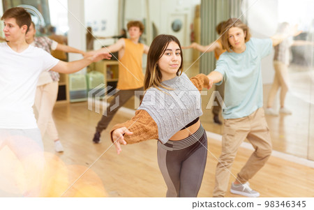 Youth boys and girls dancing salsa indoors 98346345
