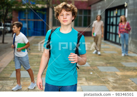 Teenager boy going to school lessons 98346501