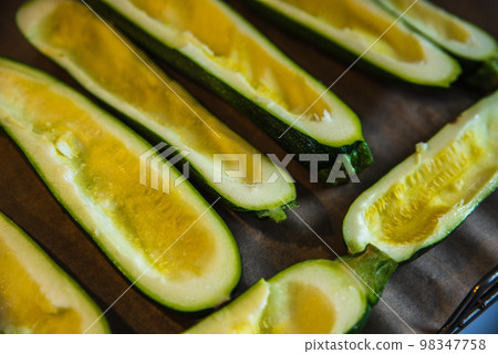 before baked zucchini with ham and vegetables, under cheese before baked zucchini with ham and vegetables, under cheese 98347758