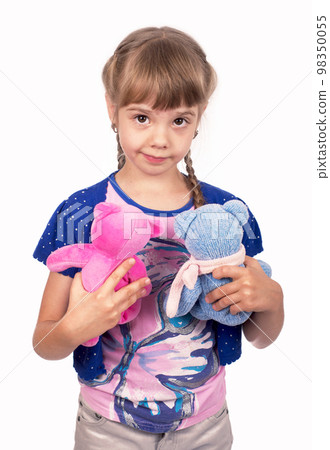Little girl holding a teddy bear. Isolated on white background. Girl hugging two teddybears. Happy child. Little girl holding a teddy bear. Isolated on white background. Girl hugging two teddybears. Happy child. 98350055