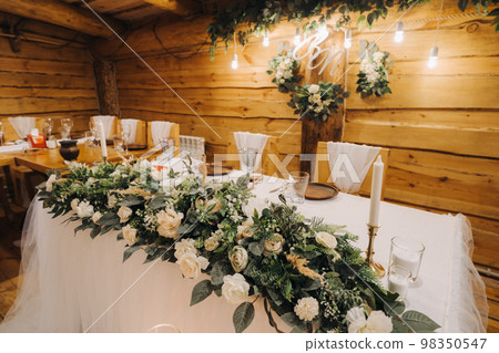 Beautiful table setting with floral decor for the holiday. Wedding decor Beautiful table setting with floral decor for the holiday. Wedding decor 98350547