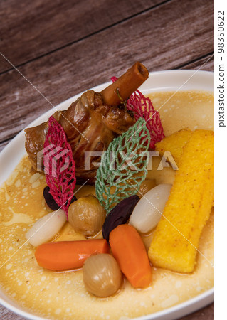 Lamb smil pie served with fried polenta, carrot, turnip, mushroom and sauce Lamb smil pie served with fried polenta, carrot, turnip, mushroom and sauce 98350622