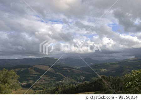 A Rustic mountain landscape with cloudy sky A Rustic mountain landscape with cloudy sky 98350814