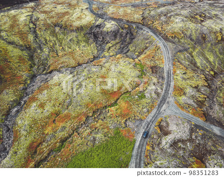 Driving trough the highlands of Iceland, drone aerial shot 98351283