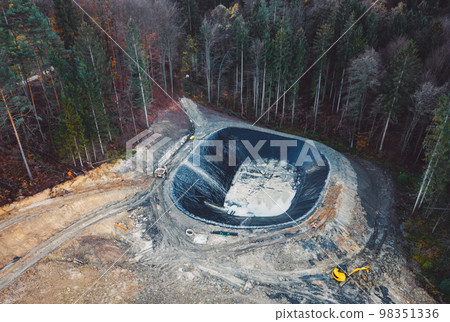 Construction site in the middle of a forest at an unknown location Construction site in the middle of a forest at an unknown location 98351336