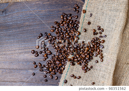Coffee beans, wood board, hemp bag Coffee beans, wood board, hemp bag 98351562