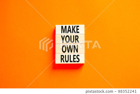 Make your own rules symbol. Concept words Make your own rules on wooden cubes. Beautiful orange table orange background. Business motivational make your own rules concept. Copy space Make your own rules symbol. Concept words Make your own rules on wooden cubes. Beautiful orange table orange background. Business motivational make your own rules concept. Copy space 98352241