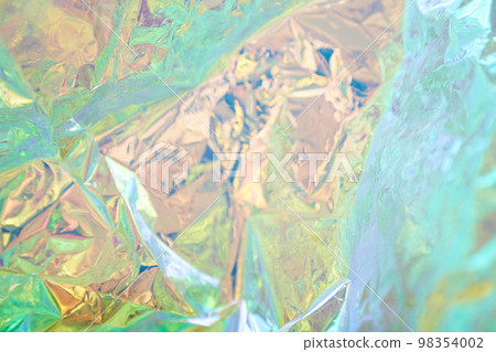 Abstract fashionable rainbow holographic background. Blurred texture of purple, pink and mint colors with irregularities. High quality photo Abstract fashionable rainbow holographic background. Blurred texture of purple, pink and mint colors with irregularities. High quality photo 98354002