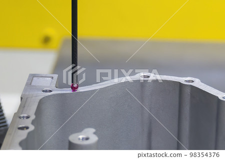 The  3-axis CMM machine measuring the aluminum parts . 98354376