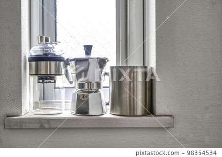 Coffee set on the kitchen window Coffee set on the kitchen window 98354534