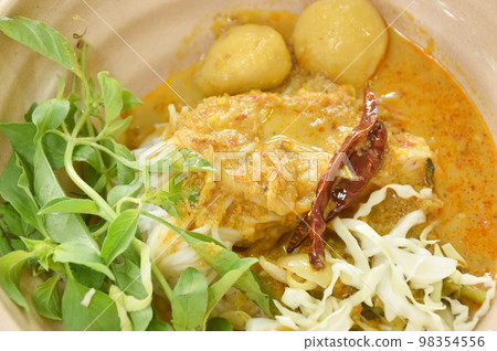 rice noodles on bowl with spicy fish curry sauce and fresh vegetable rice noodles on bowl with spicy fish curry sauce and fresh vegetable 98354556