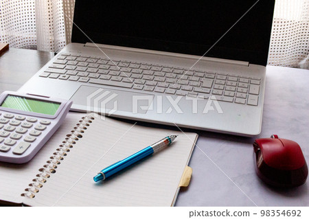 Saving image of keeping a household account book on a computer indoors 98354692