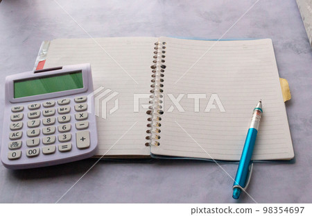 Saving image of keeping a household account book indoors Saving image of keeping a household account book indoors 98354697