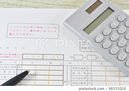 Balance sheet, calculator and ballpoint pen 98355028