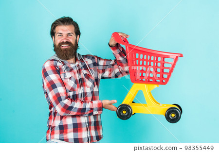 stylish bearded guy with trendy hairstyle wear checkered shirt hold shopping cart, sale stylish bearded guy with trendy hairstyle wear checkered shirt hold shopping cart, sale 98355449