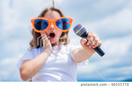 happy kid singer with mic love music, singing, selective focus 98355778