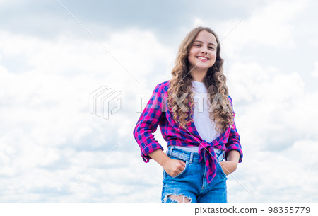Child on the background of sky. summer holiday concept. childhood happiness. happy childrens day. free your imagination. kid beauty and fashion. child wearing casual style. copy space 98355779