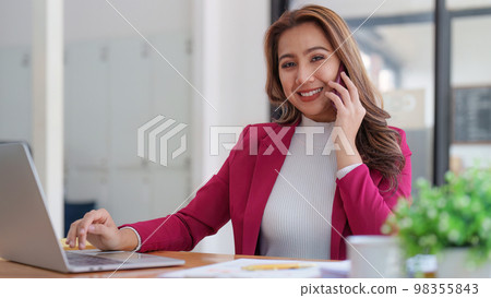 Portrait of Smiling asian business woman with laptop computer in office. Woman in suit at office 98355843