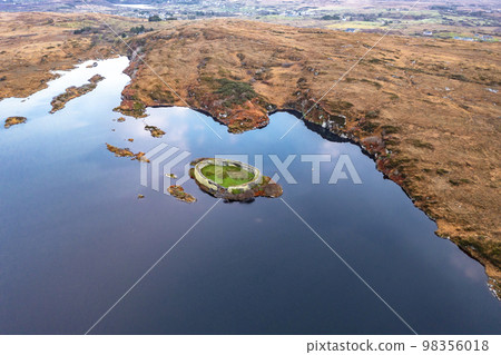 Aerial view of Lough Doon between Portnoo and Ardara which is famous for the medieval fort - County Donegal - Ireland. Aerial view of Lough Doon between Portnoo and Ardara which is famous for the medieval fort - County Donegal - Ireland. 98356018