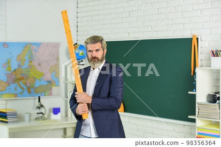 Math science. math teacher use ruler tool. back to school. university education concept. mathematics favorite subject. study geometry lesson. measurement concept. bearded man in suit. size measure Math science. math teacher use ruler tool. back to school. university education concept. mathematics favorite subject. study geometry lesson. measurement concept. bearded man in suit. size measure 98356364