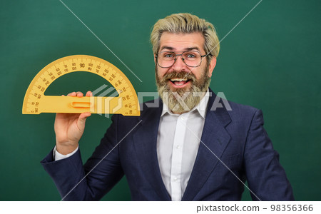 Look at this. college education concept. mathematics favorite subject. study geometry lesson. measurement concept. bearded man in suit. math teacher use protractor tool. back to school 98356366