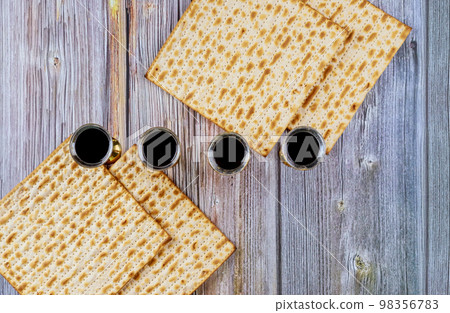 In preparation for celebration Passover, matzah is served with kiddush four cups of red kosher wine 98356783