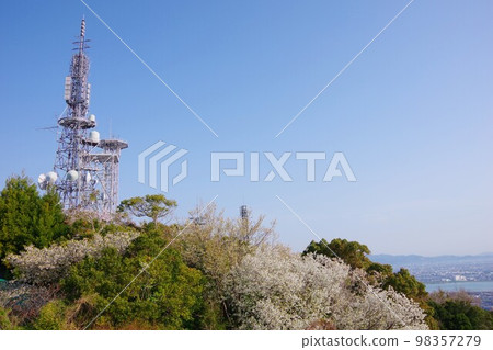 Tokushima City Cherry blossoms and radio tower on the summit of Mt. Bizan Tokushima City Cherry blossoms and radio tower on the summit of Mt. Bizan 98357279