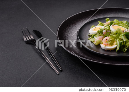 Delicious fresh healthy salad with shrimp, egg, lettuce and flax seeds Delicious fresh healthy salad with shrimp, egg, lettuce and flax seeds 98359070