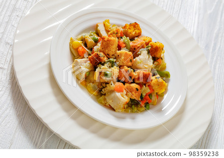 turkey pot pie with stuffing crust on plate 98359238