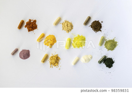 Opened and whole capsules of supplements on white background. Various pills and vitamins. From top right to left as follows: curcumin, vitamin C, ant tree bark, quercetin, q10, vegetable supplement Opened and whole capsules of supplements on white background. Various pills and vitamins. From top right to left as follows: curcumin, vitamin C, ant tree bark, quercetin, q10, vegetable supplement 98359831