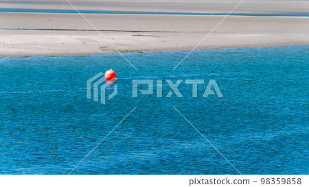orange buoy on the blue water. Seascape, a copy space. Red ball on blue sea water orange buoy on the blue water. Seascape, a copy space. Red ball on blue sea water 98359858