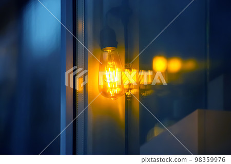 lamp in the window of a cafe showcase. details of the decorative interior of the building lamp in the window of a cafe showcase. details of the decorative interior of the building 98359976