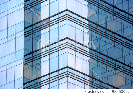 glass facade of a large modern building glass facade of a large modern building 98360092
