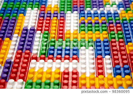 Abstract background texture of colored constructor blocks. 98360095