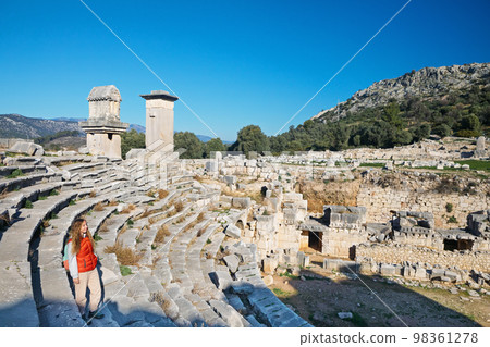Woman looking at theater of Xanthos ancient city 98361278