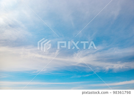 Beautiful white fluffy clouds on a bright blue sky 98361798