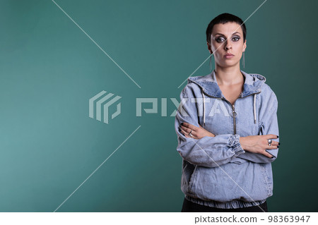 Portrait of frustrated unhappy woman looking nervous at camera while posing over isolated background in studio, having scary expression. Upset nervous female making disappointment grimacing 98363947