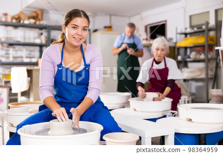 girl works with potter`s wheel girl works with potter`s wheel 98364959