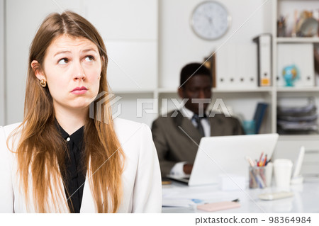 Frustrated woman at office Frustrated woman at office 98364984