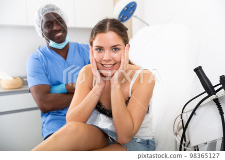 Smiling young female patient happy after cosmetological procedure 98365127