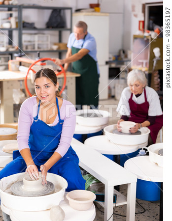 girl works with potter`s wheel girl works with potter`s wheel 98365197