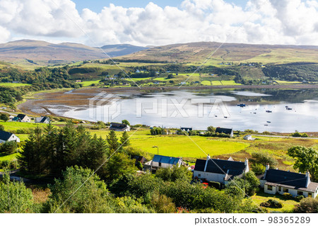 Uig village and bay in the Isle of Skye in Scotland. Uig village and bay in the Isle of Skye in Scotland. 98365289