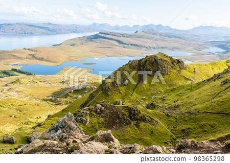 Mountainous landscape around the Storr cliffs, toward Loch Leathan, in the Isle of Skye in Scotland. 98365298